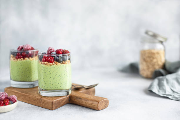 healthy matcha chia pudding with almond milk in a glass. - tea berry currant fruit imagens e fotografias de stock