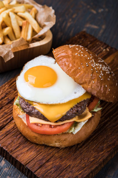 istock Burger on a wooden board 1164779127