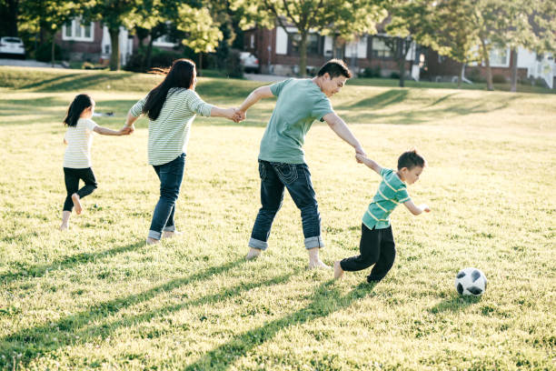 istock Family playing a soccer 1164787284