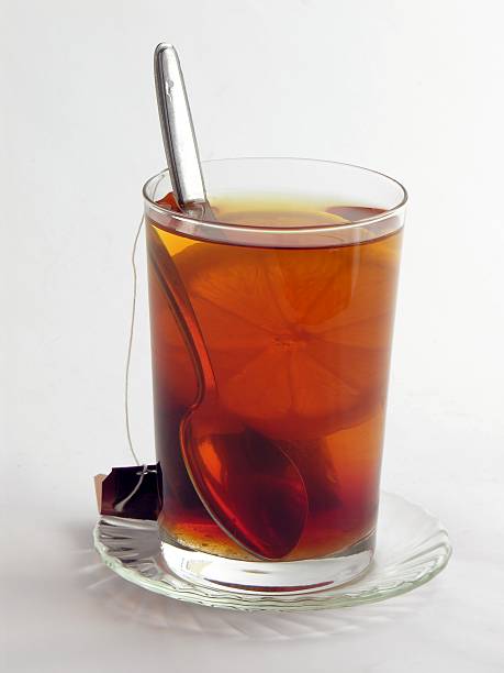 istock glass of tea and spoon 116478829
