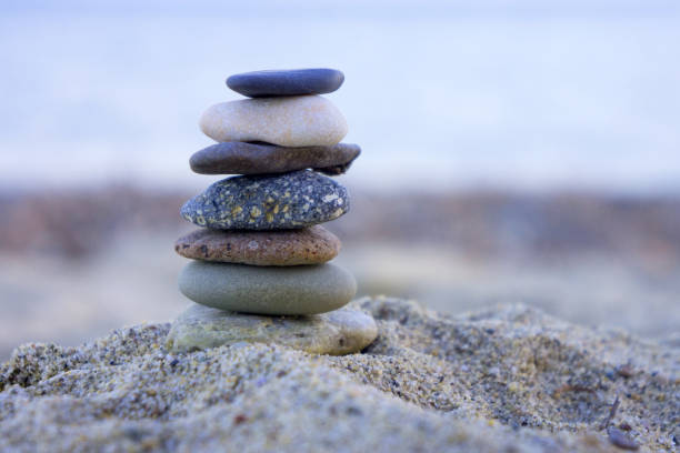 istock Relaxing in the tropical beach, with white sand and stack of stones 1164791822