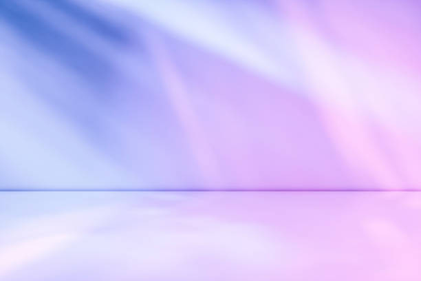 istock Beams of muted purple and blue light 1164796695