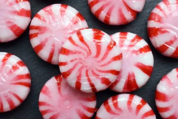 Peppermint candy on the black background