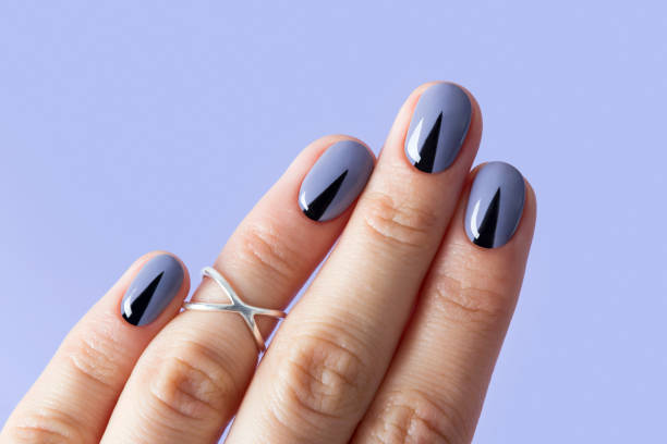 istock Beautiful woman's nails with geometric minimal manicure 1164798631