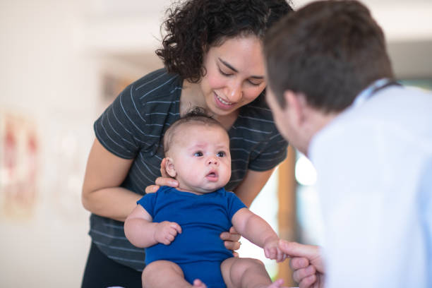 istock Mother holding her toddler 1164801413