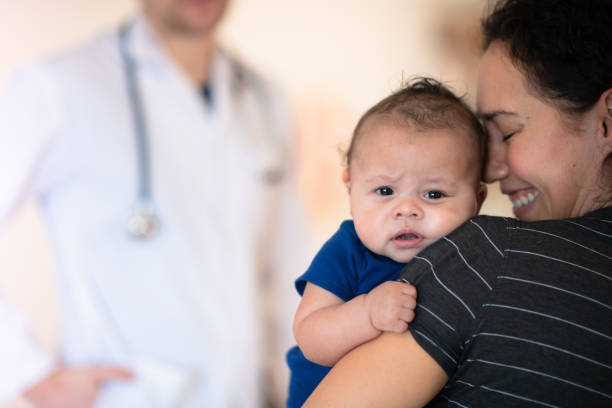 istock Mother holding her toddler 1164801420