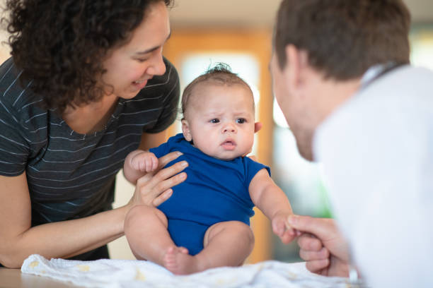 istock Mother holding her toddler 1164801423