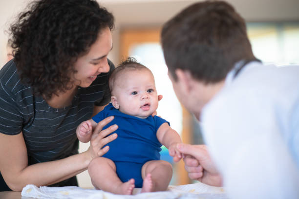 istock Mother holding her toddler 1164801424