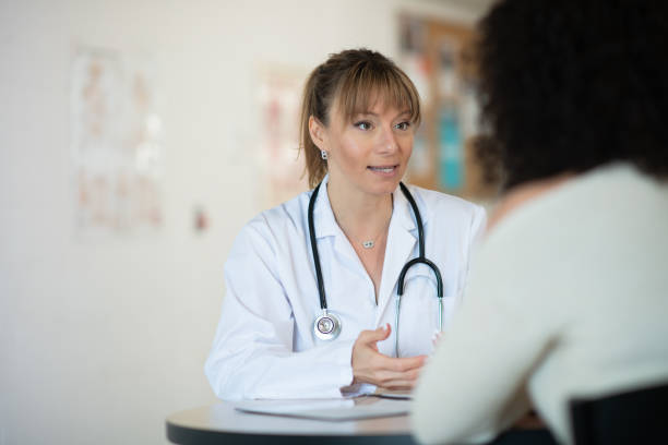 istock Doctor speaking to patient 1164801425