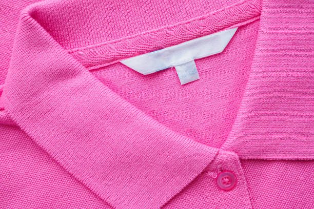istock Blank white clothes label on new shirt 1164801510