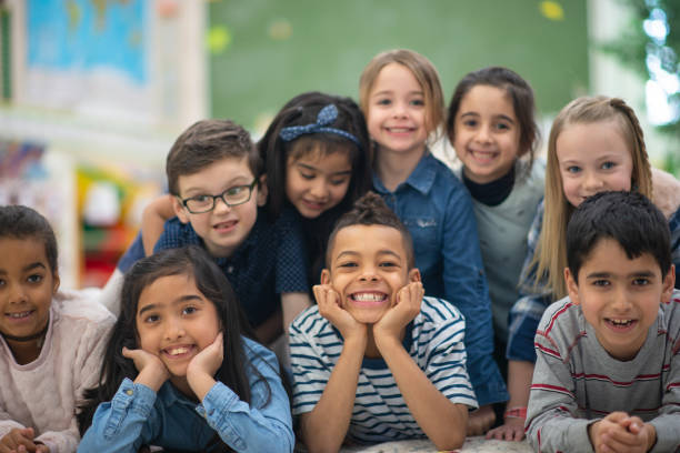 istock Group portrait of smiling elementary kids 1164801576