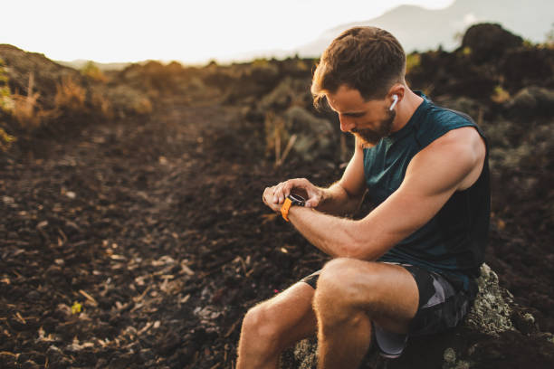istock Runner checking training results on smart watch. Male athlete using fitness tracker. 1164802138