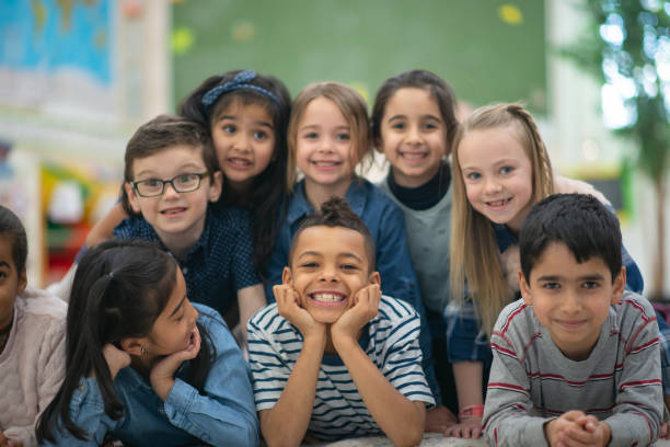 istock Group portrait of smiling elementary kids 1164802207