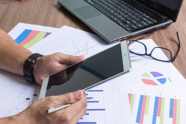 istock businessman working on his desk 1164802828