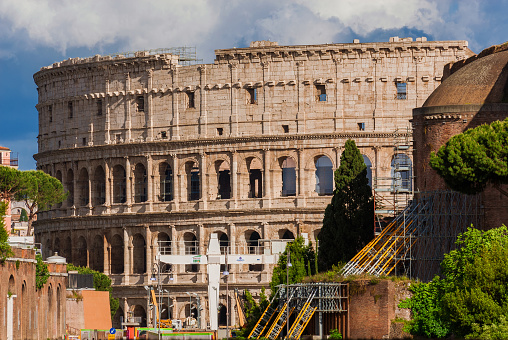 Rome, Italy - May 19, 2019: Coliseum and Imperial Fora ancient ruins with Metro C new subway line construction site, right in the center of the city