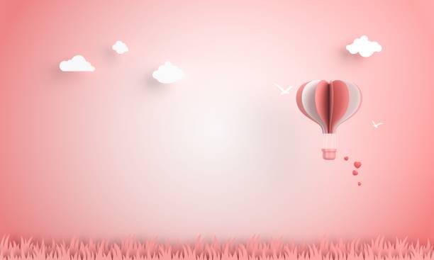 Origami hot air balloon in the sky Origami hot air balloon in the sky book heart shape valentines day copy space stock pictures, royalty-free photos & images