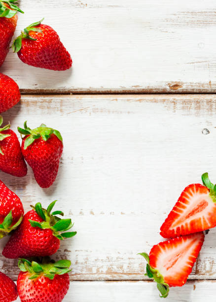istock Fresh strawberries on wooden background with copy space 1164809575
