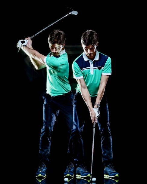 istock Golfer man golfing golf swing isolated black background multiple exposure 1164811127