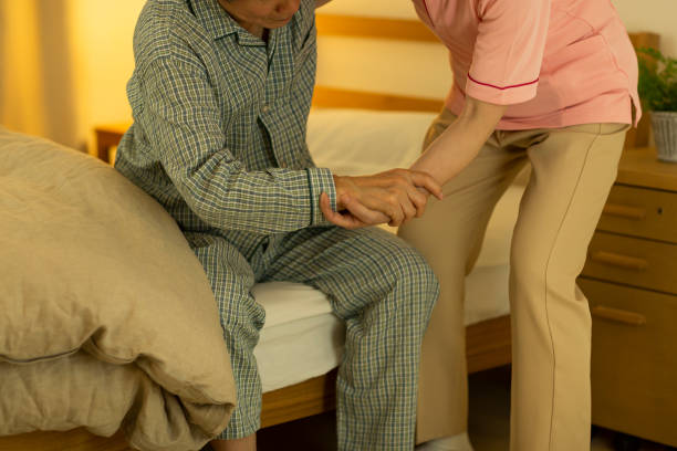 istock Carer caring for senior man 1164812827