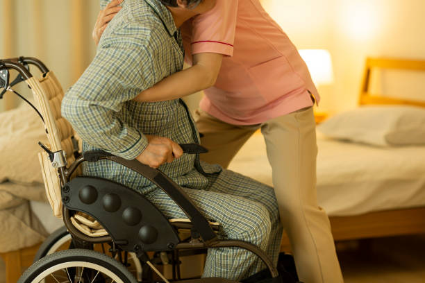 istock Carer caring for senior man 1164812828