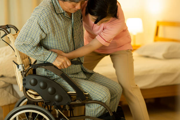 istock Carer caring for senior man 1164812836