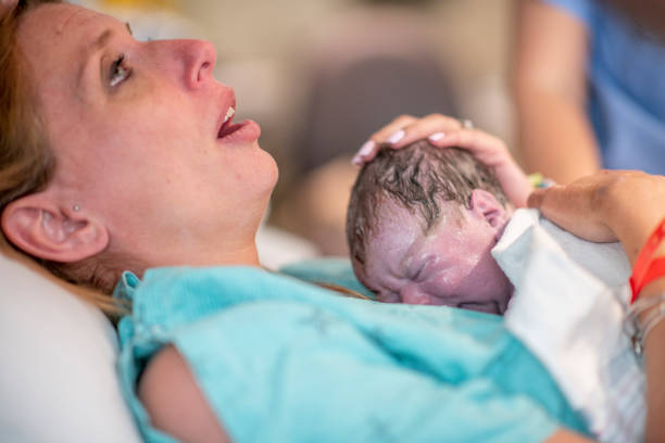 istock Beautiful baby girl is born. 1164815421