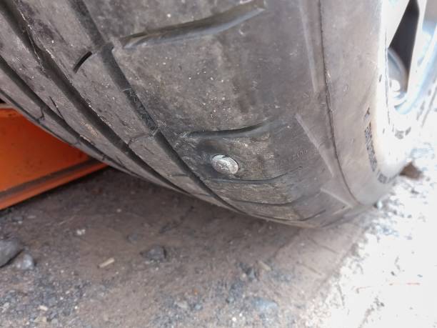istock Nail stab into the tire 1164815504