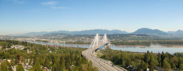 Trans Canada Highway Aerial Aerial panoramic view of Trans Canada Highway near the Port Mann Bridge during a sunny morning. Taken in Surrey, Vancouver, BC, Canada. surrey british columbia stock pictures, royalty-free photos & images