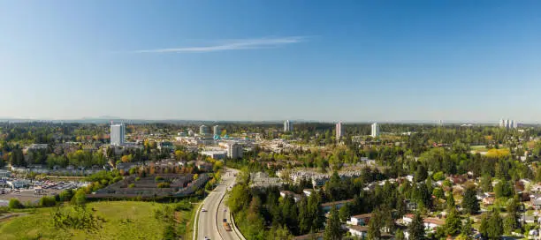 Aerial panoramic view of a residential neighborhood near Guildford Centre Mall during a sunny morning. Taken in Surrey, Vancouver, BC, Canada.