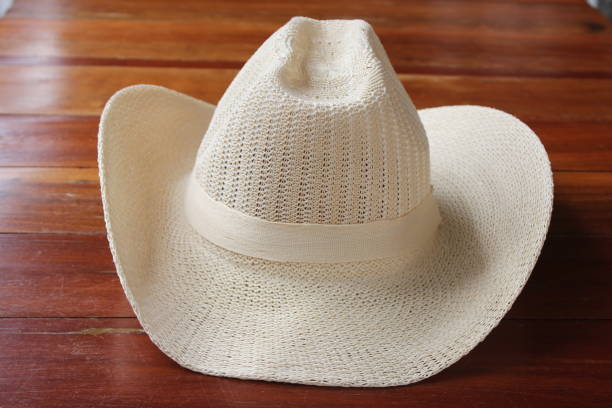 istock Summer men's sun hat on wooden surface. 1164818487