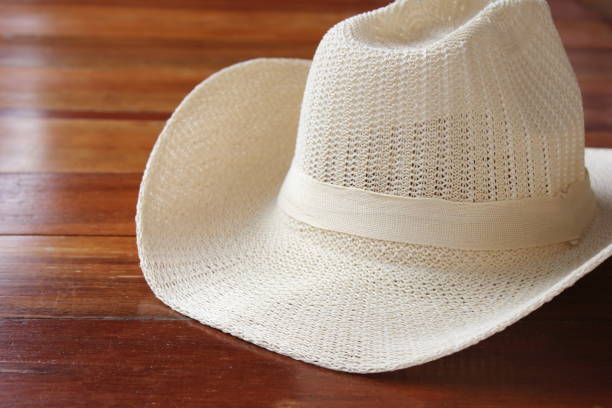 istock Summer men's sun hat on wooden surface. 1164818523
