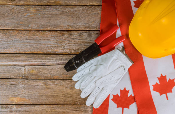 canadian flag labor day two protective hardhats top view concept of labor and employment - canadian flag canada flag canada day imagens e fotografias de stock