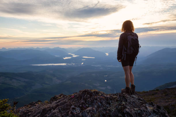 istock Adventurous Girl Hiking in the Mountains 1164819199