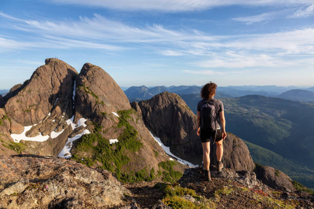 istock Adventurous Girl Hiking in the Mountains 1164819321