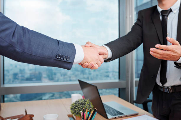istock Business partners shaking hands 1164823130