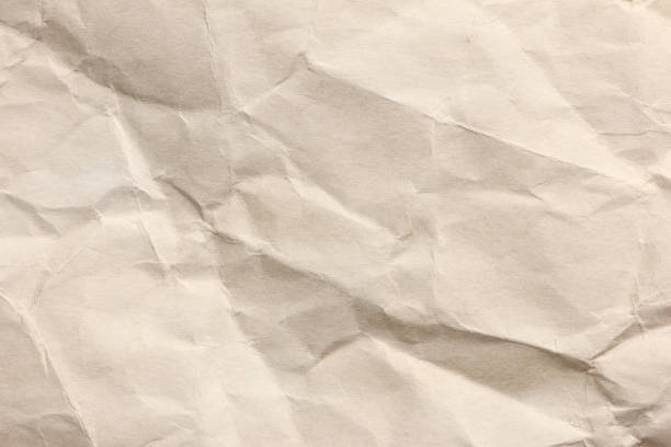 istock Clean brown paper, wrinkled, abstract for background. 1164824381