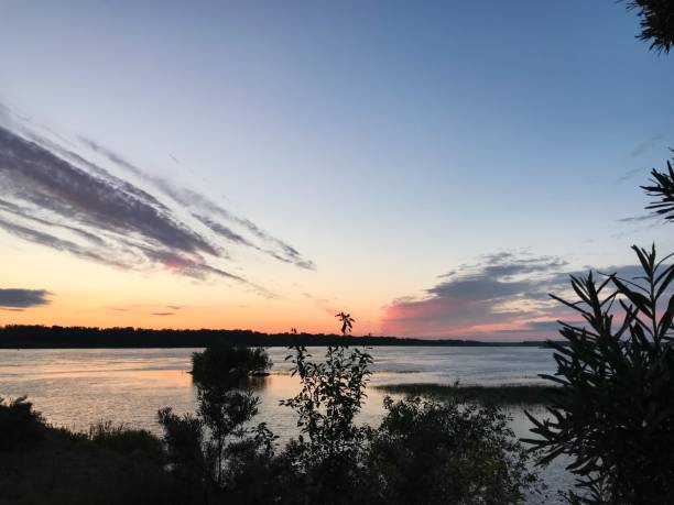 istock Fiery sunset from the blue sky to the river. 1164824567