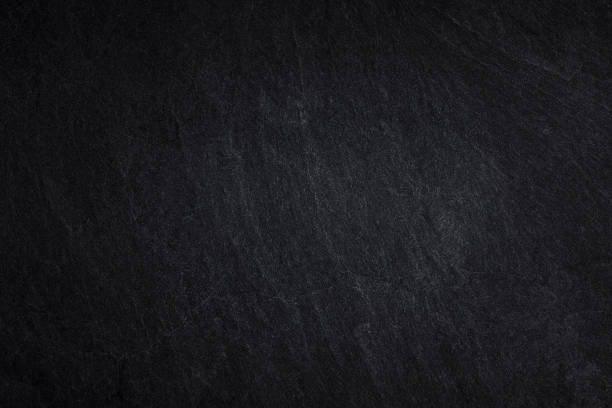 istock Dark grey black stone for background or natural black slate texture 1164826147