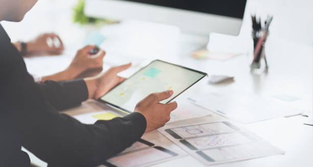 istock UI graphic designer team planing the concepts 1164826494