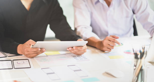 istock Professional UI UX designer team picking up the ideas 1164826499
