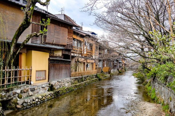 istock Japanese building along flowing river. 1164831980