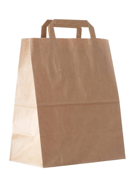 istock New empty blank paper bag with handles without inscriptions and logos. Made from brown kraft paper. Isolated on white background. 1164832624