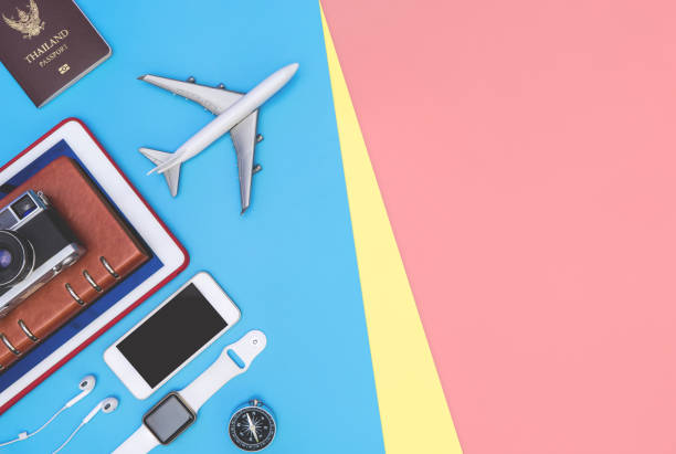 istock travel objects and accessories on blue yellow pink background with passport camera and plane 1164832935