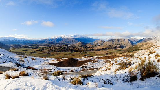 Panorama view of landscape along crown range road, Queenstown, New Zealand. Winter season of New Zealand. Snow covered mountain.