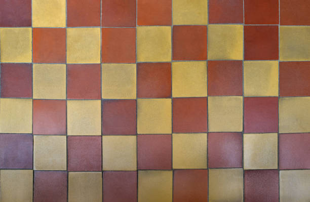 istock Old shabby square ceramic floor tiles (mettlach tiles).  Chequered pattern. Top view. 1164834047