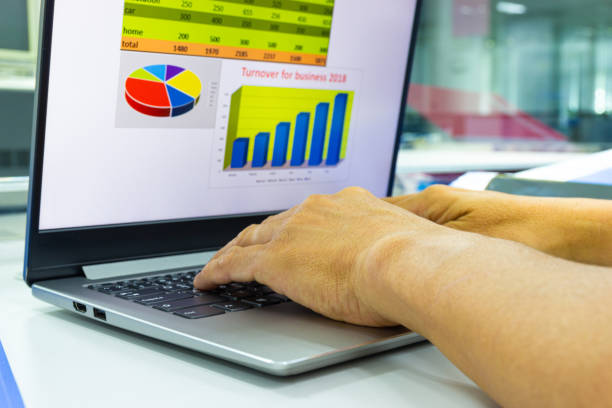 istock business man working on laptop with chart on display in work office 1164838127