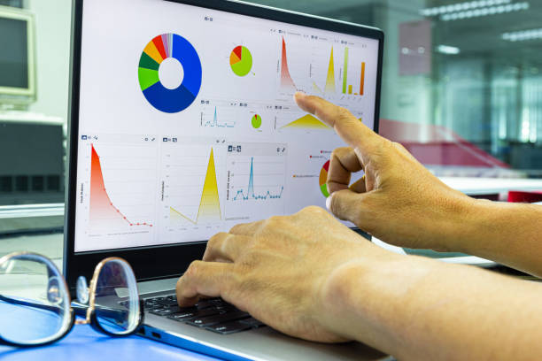 istock business man working on laptop with chart on display in work office 1164838129