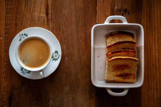 istock cup of coffee and fried toast 1164838363