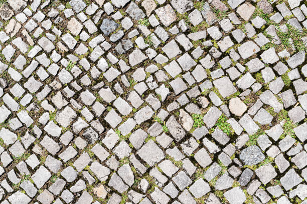 istock top view shot of cobblestone pavement background 1164839003