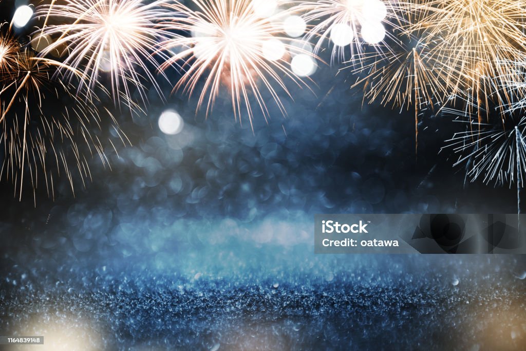 Gold and blue Fireworks and bokeh in New Year eve and copy space. Abstract background holiday. Backgrounds Stock Photo